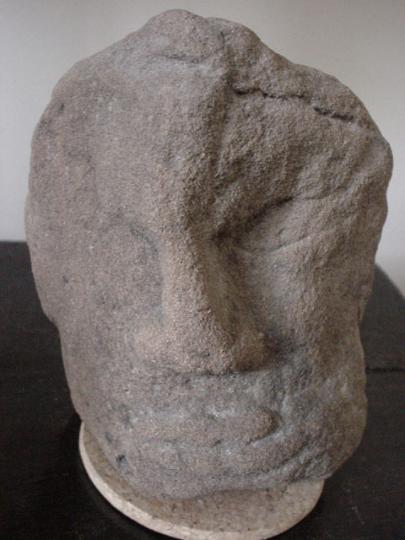 English medieval sandstone head from the archivolt of a door or window