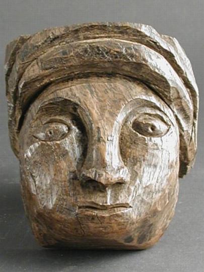 English thirteenth century oak carved head of a carpenter