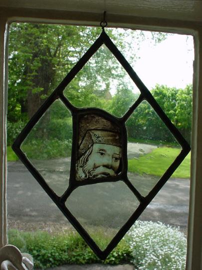 A piece of English fifteenth century glass from Norwich depicting the head of a man
