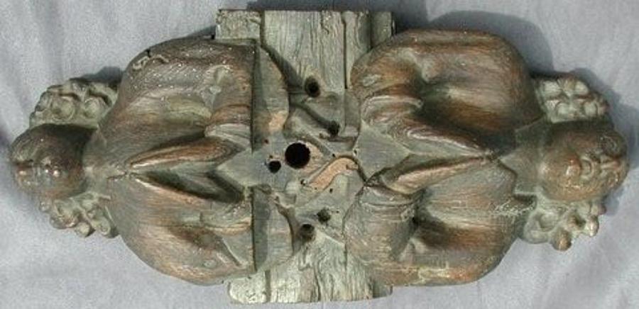 English fifteenth century oak roof boss of two opposing angels